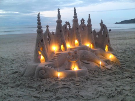 Sand castle with candles.