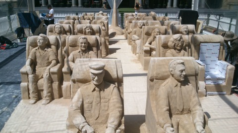 Sand sculptures of passengers for corporate sand sculpting event.